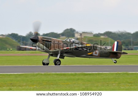 FAIRFORD, UK - JULY 8: Royal Air Force Spitfire aircraft participates in the Royal International Air Tattoo airshow event July 8, 2012 near Cirencester, England.