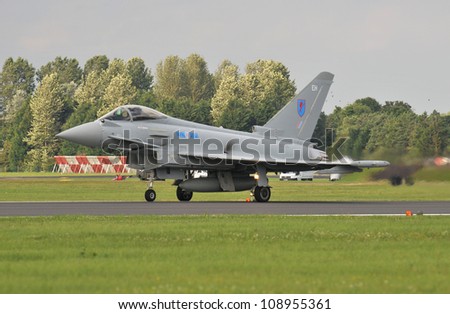 FAIRFORD, UK - JULY 8: Royal Air Force Typhoon aircraft participates in the Royal International Air Tattoo airshow event July 8, 2012 near Cirencester, England.