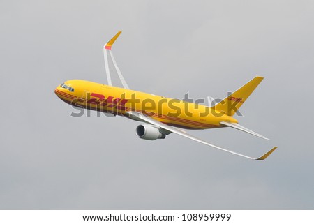 FAIRFORD, UK - JULY 8: DHL 767 aircraft participates in the Royal International Air Tattoo airshow event July 8, 2012 near Cirencester, England.