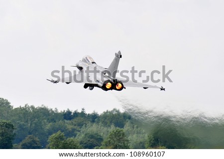 FAIRFORD, UK - JULY 8: french Air Force Rafale participates in the Royal International Air Tattoo airshow event July 8, 2012 near Cirencester, England.