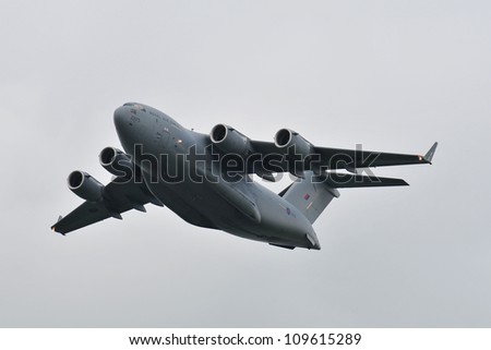 FAIRFORD, UK - JULY 8: Royal Air Force C-17 Globemaster Transport aircraft participates in the Royal International Air Tattoo airshow event July 8, 2009 near Cirencester, England.