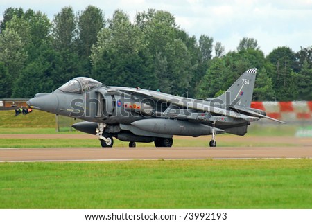FAIRFORD, UK - JULY 18: Royal Air Force Harrier aircraft participates in the Royal International Air Tattoo airshow event July 18, 2009 near Cirencester, England.