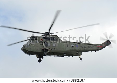 FAIRFORD, UK - JULY 18: Royal Navy Sea King Helicopter participates in the Royal International Air Tattoo airshow event July 18, 2009 near Cirencester, England.