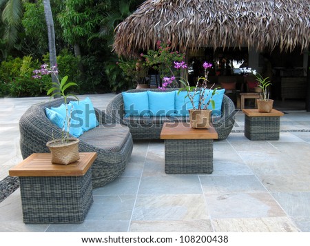 rattan furniture in tropical setting