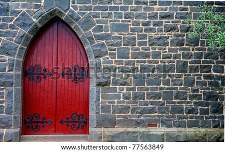 red wooden door in bluestone church
