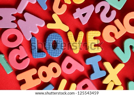 Close-up of a lot of letters of the English alphabet. Word love