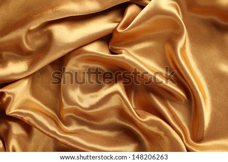 Background of bright shiny yellow/gold silk