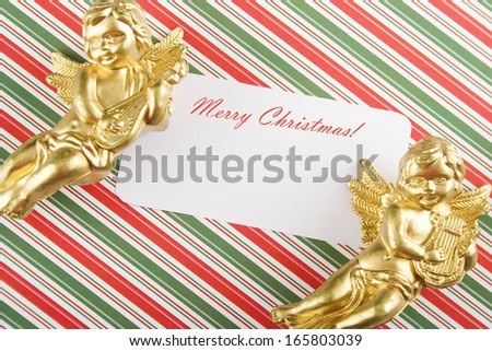 Close-up Christmas card. Paper, angels, holiday greetings