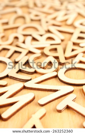 Wooden letters and numbers laid out in a row