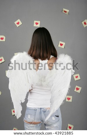 Beautiful woman as angel. portrait. studio shot back