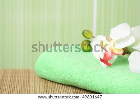 Bathroom in green tones. Towel green it is a white orchid