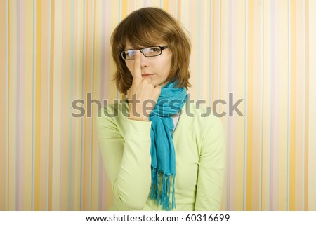 Beautiful young woman in glasses. Correcting glasses