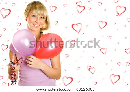 Close-up of a beautiful young woman with colorful balloons balloons. On the background of red hearts