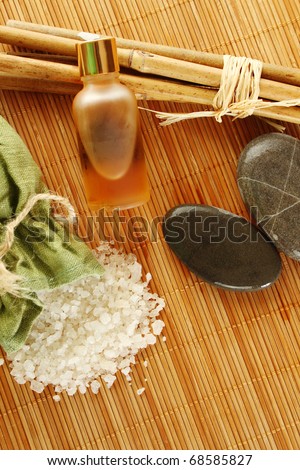 Facilities for body care in a fabric bag of bath salts, related to bamboo sticks, stones and bottles with oils