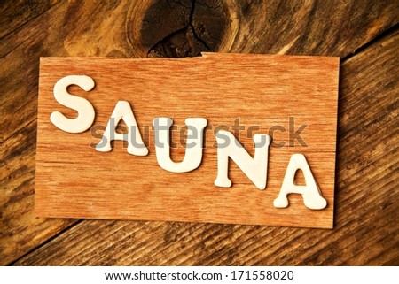 the German word SAUNA ( sauna ) on wood