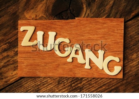 the German word ZUGANG ( access ) on wood