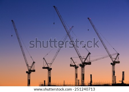 Many cranes at Australian construction site (Sunshine Coast, Kawana Waters, QLD, Australia) - all logos removed