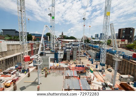 construction site with a few cranes at early stage (brisbane, qld, australia) - all logos and names removed