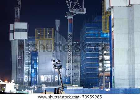 screen system and scaffold on the construction building at night (gold coast,qld,australia,march 2011)