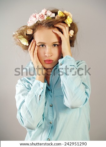 The girl\'s portrait in a blue shirt. Emotions