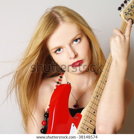 stock photo Beautiful sexy guitar woman on white background looking 