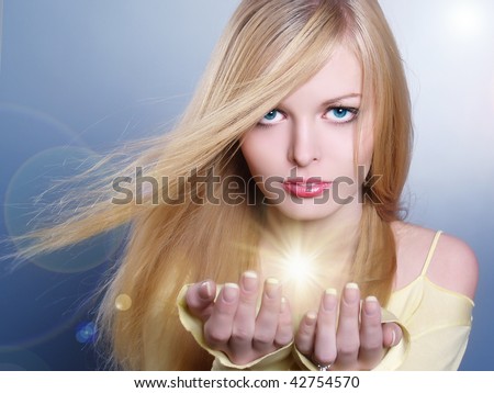 Portrait of the beautiful girl with bright fires and patches of light