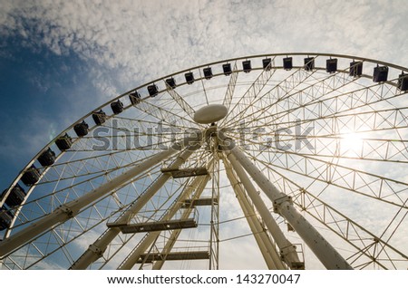 Big ferris wheel with cloudy sky