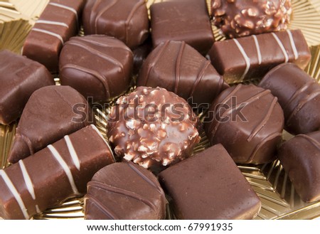 Box of chocolates with gold background