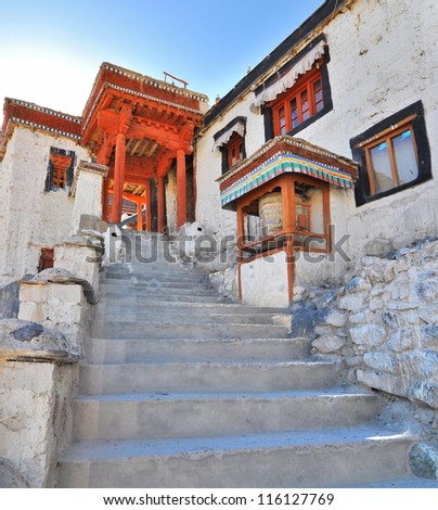 a portion of Diskit monastery with stairs towards colorful door  in leh, Ladakh, India