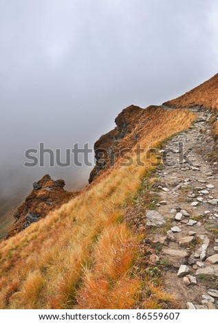 close up of mountain slope with a path