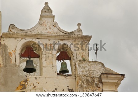 two bells in an old bell tower of a country church in Procida italy