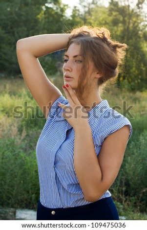 Beautiful sexy face of an young woman with fresh health skin. Female posing on the nature