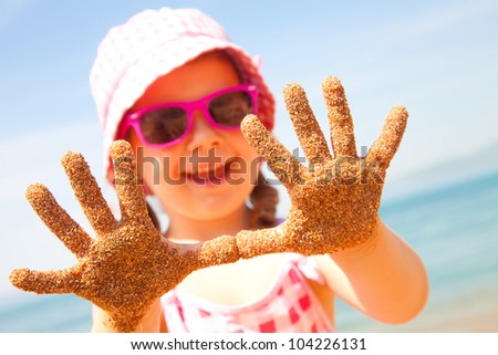 Little girl have a good time of resort beach Little girl have a good time of resort beach