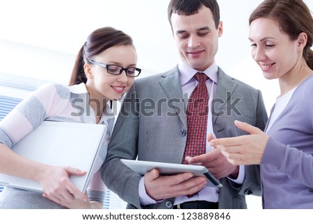 Contemporary business people working in team in the office