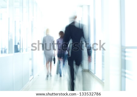 Businesspeople Walking In The Corridor Of An Business Center, Pronounced Motion Blur