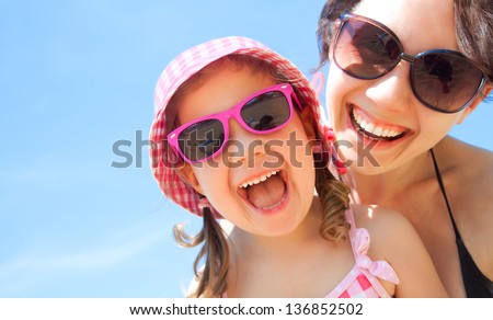 Little Girl And Her Mother Have A Good Time At The Seaside Resort
