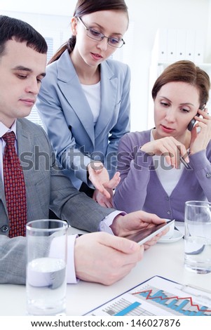 Contemporary business people working in team in the office