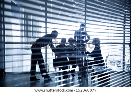 Several Silhouettes Of Businesspeople Interacting Background Business Centrer