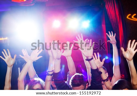 Many hands of the crowd at a youth disco