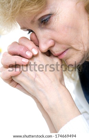 portrait of an elderly woman in crying
