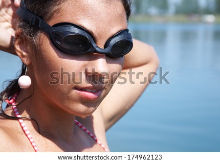 Young woman swimmer portrait. Open water.