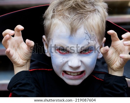 little boy curve faces in fairy costume on holiday halloween
