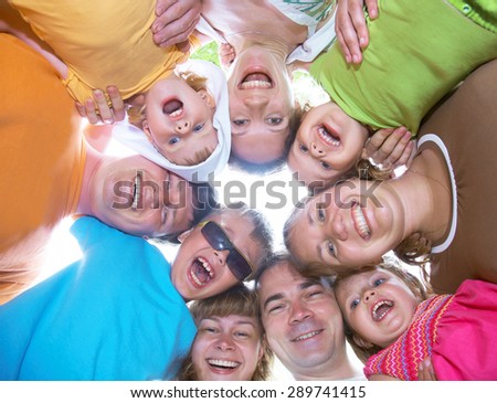 large family with children having fun together in the nature