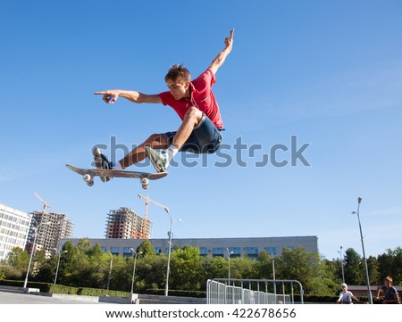 cool skateboard is jumping high in air