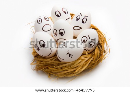 stock photo : funny Easter eggs painted with a person lying in the nest