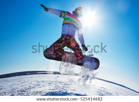 Extreme winter on snowboard in mountains