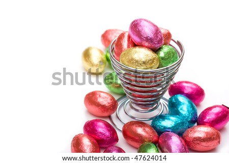 Mini chocolate eggs in wire eggcup