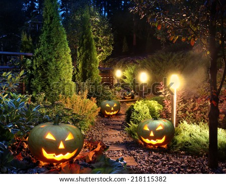 Illuminated home garden path patio lights with halloween pumpkin lanterns