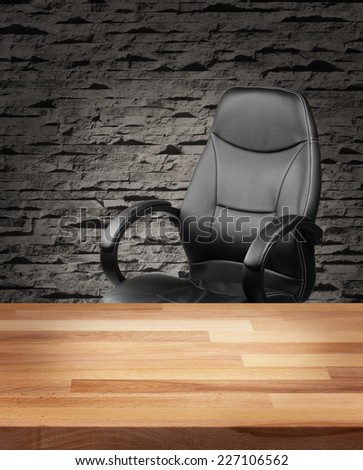 Executive leather chair and wooden table in luxury office interior