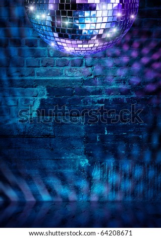 Mirror ball lights on dramatic dark disco brick wall